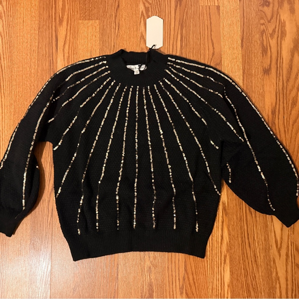 Black Sweater with Gold Accents